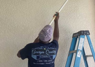 George's Quality Construction employee painting ceiling | Red Flags You Should Not Ignore from Contractors