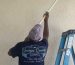 George's Quality Construction employee painting ceiling | Red Flags You Should Not Ignore from Contractors